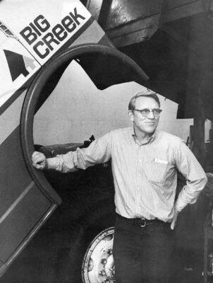 Man in front of truck fender