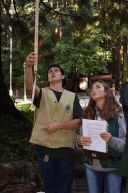 Student collecting data in a forest.