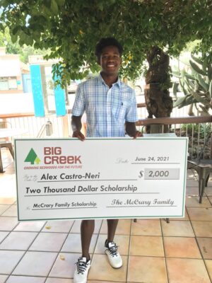 Man with big check