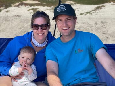 Woman, man and baby at the beach