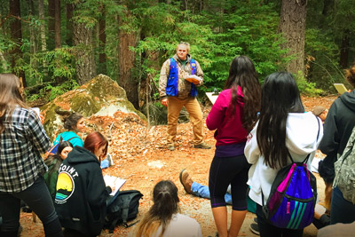 Young students in a forest education seminar.
