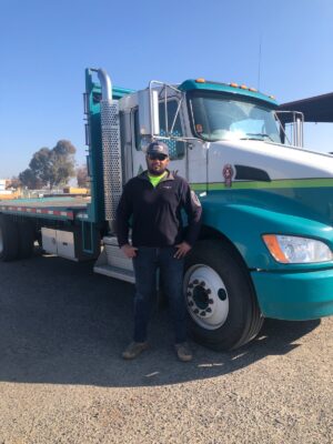 Man standing in front of truck 