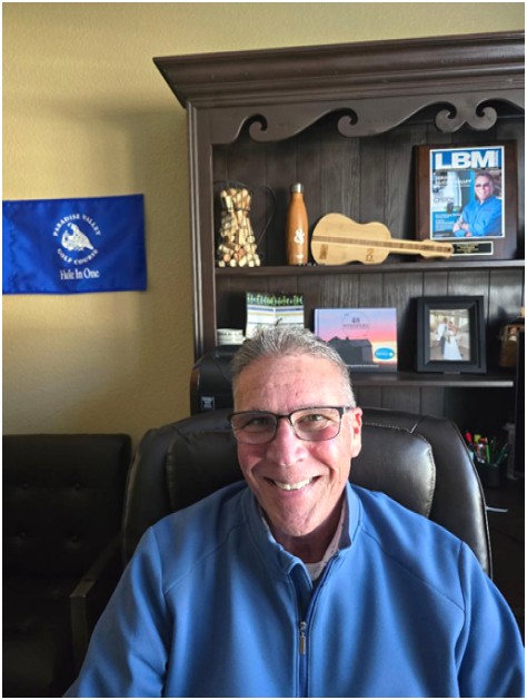 Man sitting in chair smiling