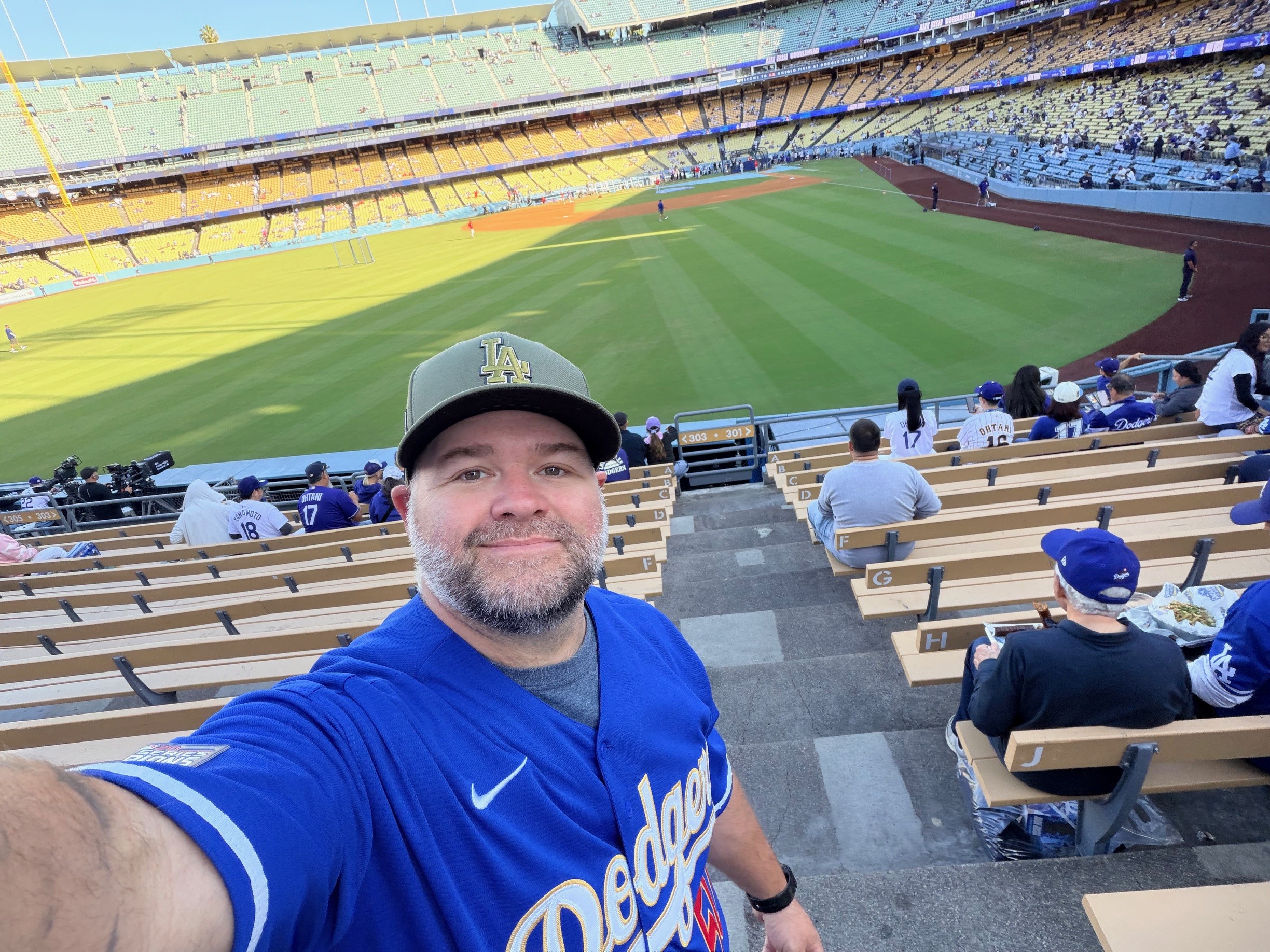 Man in baseball hat at game.