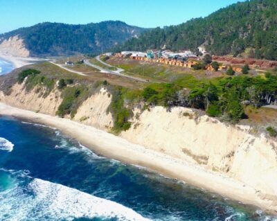 Aerial View of Sawmill and cliff and ocean from an airplane