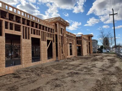 Side view of a building that is framed out of wood being built