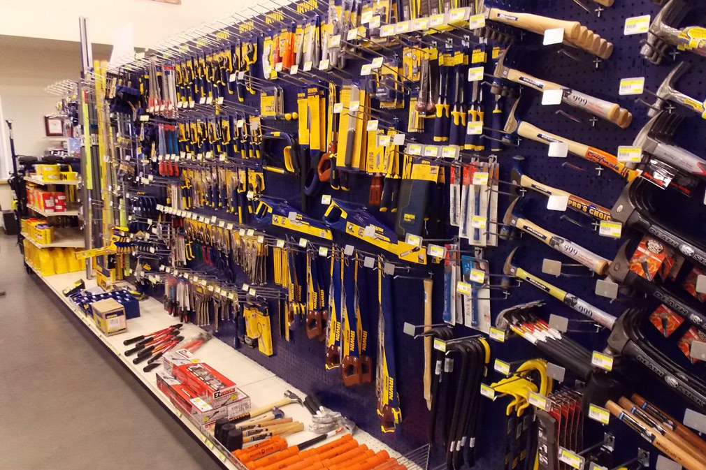 Retail wall with hammers and other tools.